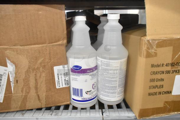 11-item lot including Diversey Oxivir Tb sanitizer bottles and cardboard boxes, visible labels, good condition.