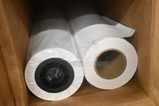 Two large white paper rolls inside a cardboard box. Part of a lot with 11 various items including crayons, Scott dispenser, and Diversey sanitizer bottles.