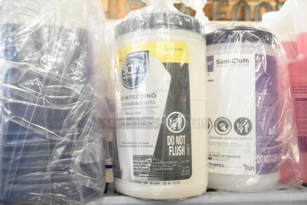 A tier lot of items including Sani Professional Disinfecting Multi-Surface Wipes and Bettco Skin Cleanser. Items sealed in plastic.