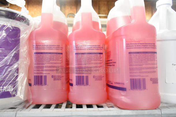 Tier lot including pink Odor Eliminator & Cleaner Concentrate bottles, visible labels with barcodes, part of mixed item auction.