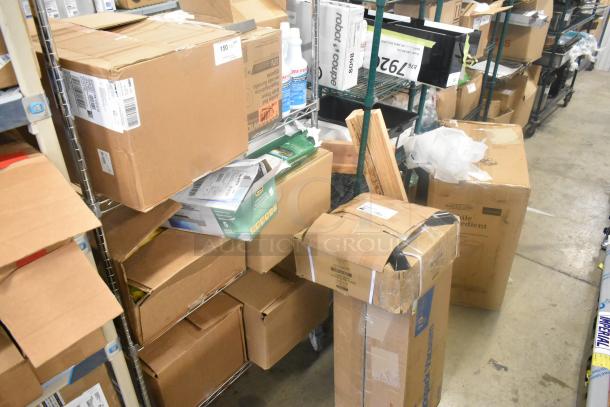 15 assorted items including Betco disinfectant, jumbo bath tissue, laminator. Bulk boxes with visible labels on shelves.
