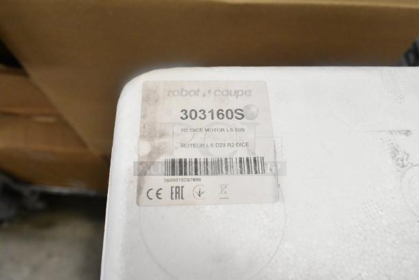 Brand new Robot Coupe 303160S motor assembly for R2 series, minor scratches. Label with model info, barcode visible.