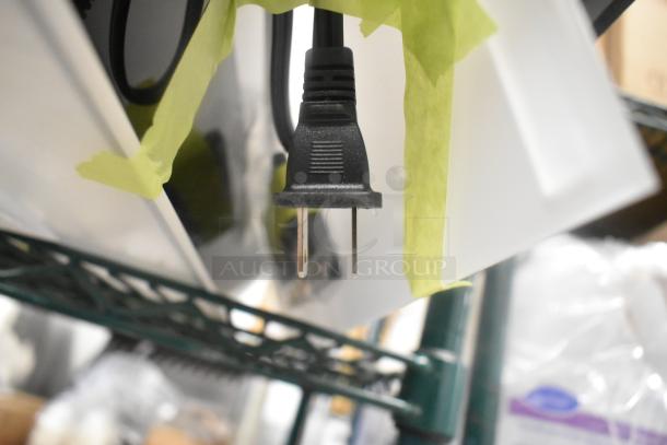BRAND NEW Beverage-Air LBD2-24L liquor display plug visible, green tape securing; scratch and dent condition.