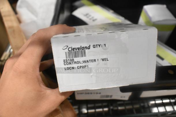 4 Brand New Scratch and Dent items including Cleveland 23198 Control; Water Level. Box shows label with item details.