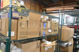 13 assorted items including Coastwide Glass Cleaner and a monitor bracket, stored in boxes on metal shelving.