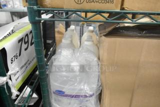 Shelving with Diversey sanitizer, Oxivir wipes, Coastwide foaming hand soap, Betco cleanser. Bulk packaging, new condition.