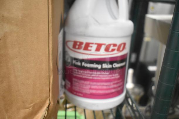 12 diverse cleaning products include Betco Pink Foaming Cleanser, Coastwide Soap, Diversey Sanitizer, and Oxivir Wipes.