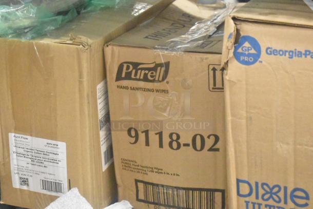 Boxes of Dixie Ultra napkins, Purell hand sanitizing wipes, and Aunt Flow tampon cartridges. Visible labels detail contents and origin.
