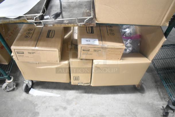 Six boxes of various items, including Rubbermaid Auto Foam, on a cart. Visible label reads "Auto Foam 1100 mL."