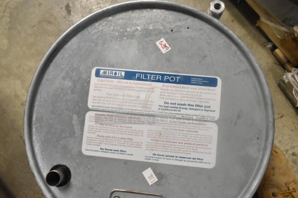 Miroil Metal Filter Pot with caution label, used condition, designed for manual filtering, visible drain spout.