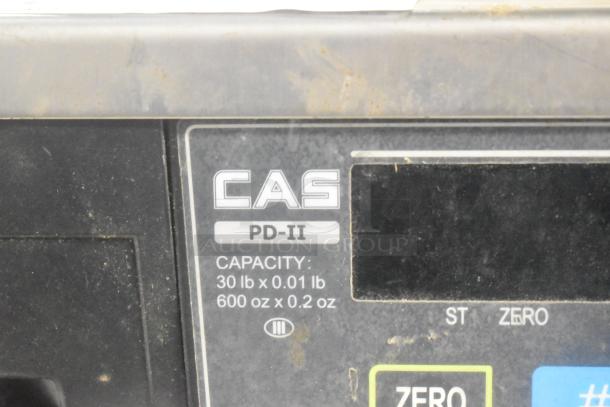 CAS PD-II metal countertop scale, 30 lb capacity, includes zero and tare functions; visible wear on surface.