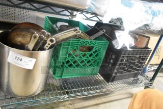 Tier lot with various items including metal skillets in crates. Auction label indicating "Tier Lot" with the number 174.