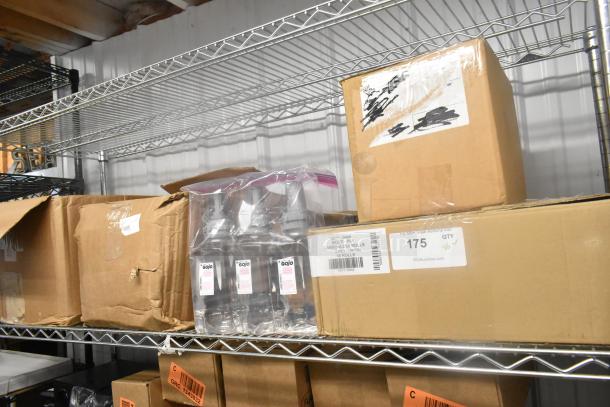 Boxes of carbonless rolls, GoJo foam handwash bottles, and a Scott dispenser on metal shelf. Visible labels show item counts.