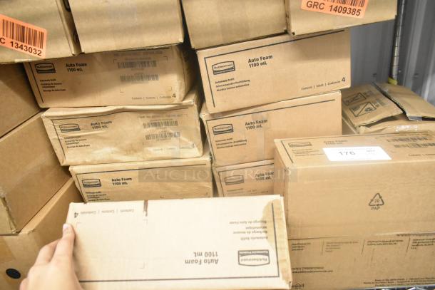 Boxes of Rubbermaid Auto Foam 1100 mL refills stacked, unopened condition, labels show item details and quantity.
