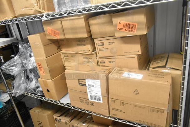 Sealed boxes of Rubbermaid Auto Foam and other restroom supplies on metal shelving, featuring labels and barcodes.