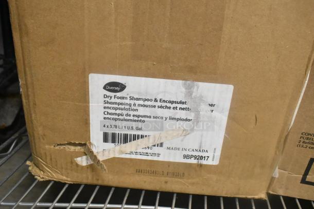 Box with Diversey Dry Foam Shampoo & Encapsulant Cleaner, made in Canada, 4 x 3.78L (1 U.S. Gal) each. Label indicates product details.