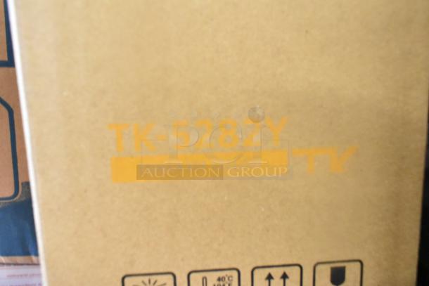 Cardboard box labeled "TK-5282Y Toner Kit Yellow." Contains 20 various items, including Bunn filters and Diversey sanitizer.