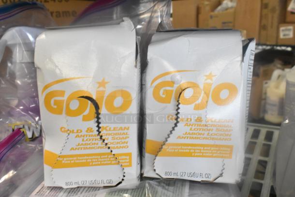Two Gojo Gold & Klean Antimicrobial Lotion Soap boxes, 800 ml each, slightly dented packaging.