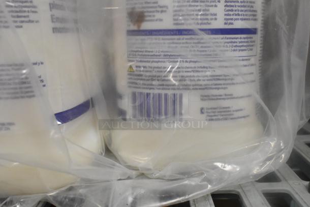 Plastic-wrapped items including bottled products with visible barcodes and ingredients label, hinting at cleaning supplies.