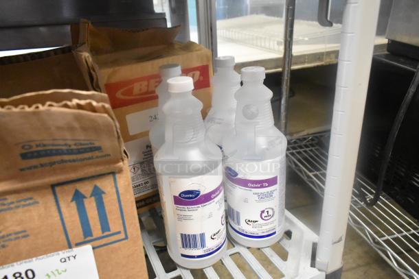 Twelve various cleaning items including Scott Foam Cleanser and Oxivir TB, shown in bottles and boxes, auctioned at 12 times your bid.