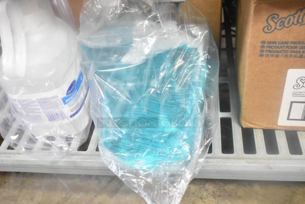 Various cleaning items including Scott Foam Skin Cleanser, washroom cleaner, and peroxide cleaner, in packaging.