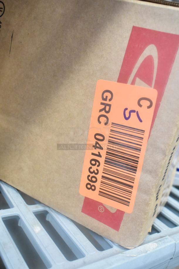 Cardboard box with label "GRC 0416398," containing 12 items like Scott Foam Skin Cleanser, Washroom Cleaner. Auction lot.