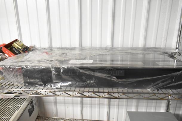 2024 SSDQ-DBL-36A Electric Fireplace, 120 Volts, 1 Phase, sealed in plastic, resting on a metal shelf.