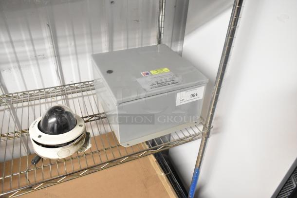 Berner Control Panel, 120 Volts, 1 Phase, gray metal, with visible labels on top, in good condition on a shelf.