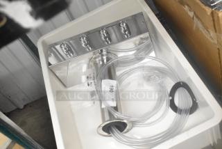 Brand new stainless steel 4 tap beer tower in scratch and dent condition, with labels and tubing included.