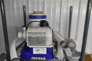 90403E Filter Pump, 110-120V, 1-phase, with hoses and fittings on a shelf, model details visible.