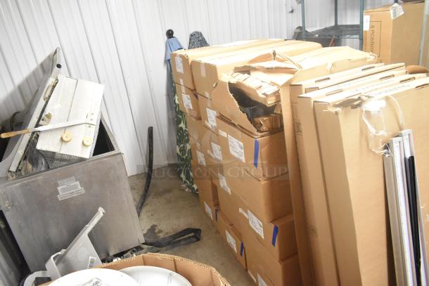 18 Evolve LED Series Area Lights in original packaging, boxes show wear. Ideal for large-scale lighting projects.