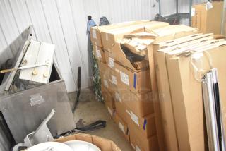 18 Evolve LED Series Area Lights in original packaging, boxes show wear. Ideal for large-scale lighting projects.