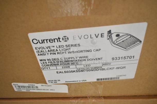 Box containing 18 Current Evolve LED Series Area Lights, model EALS035K5SM750NDD1BLCKF-WQR, 480V, 239W, new condition.