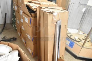 5 i2Systems NX1-11W-00K-00-S-FX1-S lights in boxes, some with damaged packaging, include installation hardware.