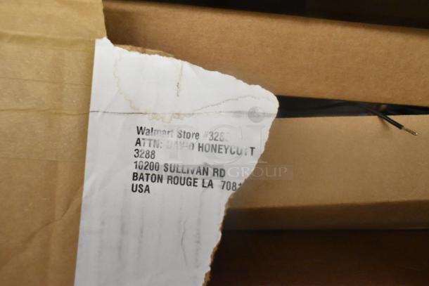 Brown box with a torn shipping label addressed to Walmart Store #3288, Baton Rouge, LA. Visible wire protruding.