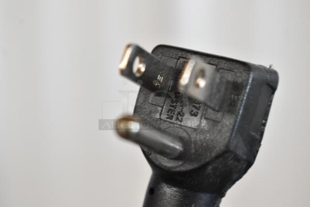 Close-up view of the plug for a 2020 Traulsen UPT6024-LR Stainless Steel Prep Table, commercial-grade, 115 volts, 1 phase.