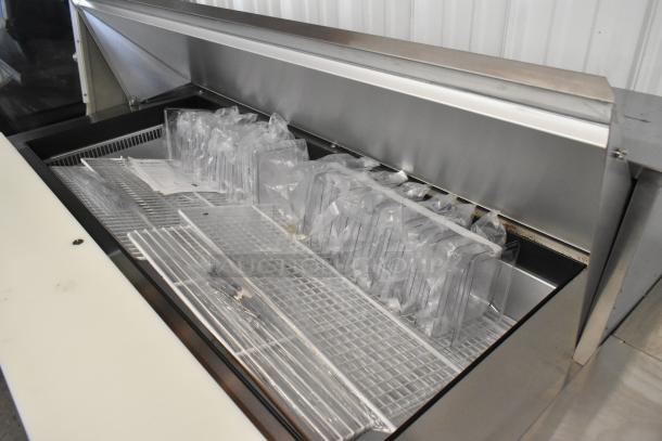 Brand new 2020 Traulsen UPT6024-LR stainless steel prep table with bain marie top on casters, 115V, minor scratches.