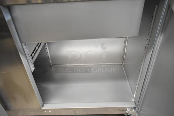 Brand new 2020 Traulsen UPT6024-LR stainless steel prep table interior. Commercial-grade with adjustable shelving.