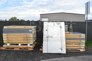 Norlake self-contained walk-in cooler box with CPB075PC-5-0 condenser and compressor, displayed on pallets, new condition.