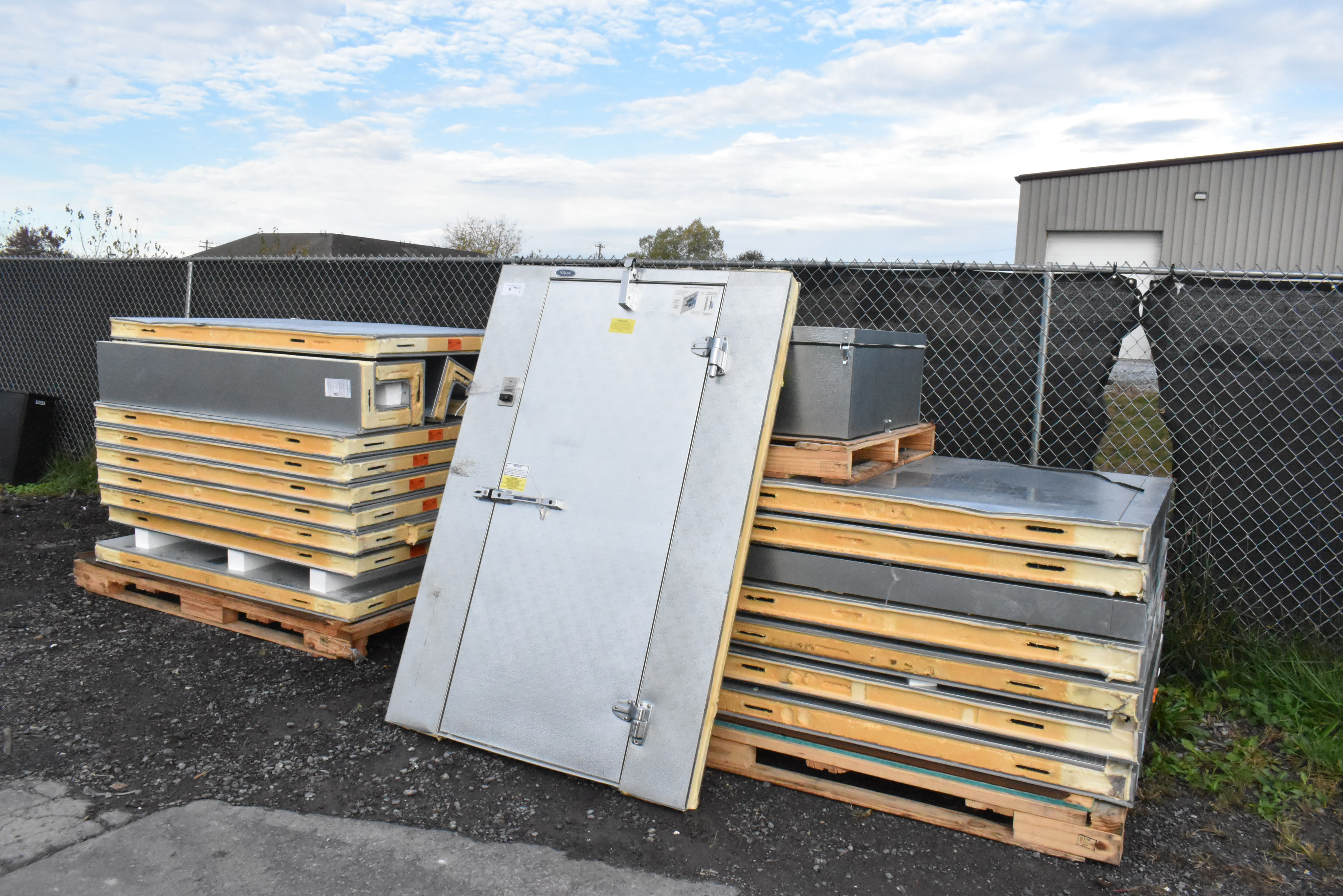 Walk-in floor panels stacked showing insulated construction