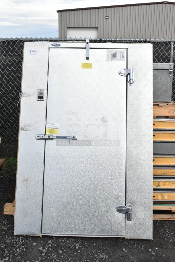 Norlake self-contained walk-in cooler with CPB075PC-5-0 condenser. Visible labels, industrial door latch. Good condition.