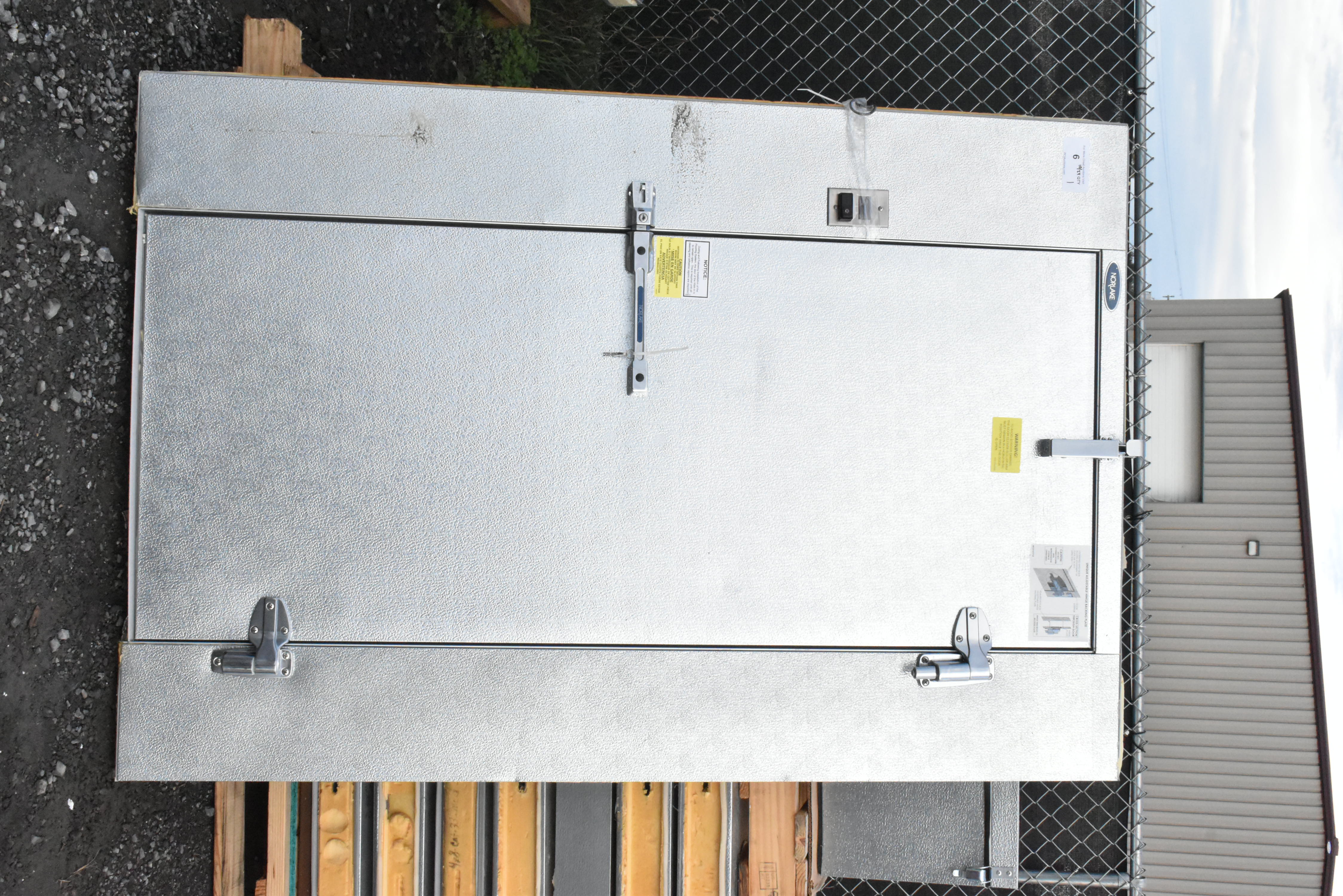 Walk-in cooler door and frame showing gasket and hardware
