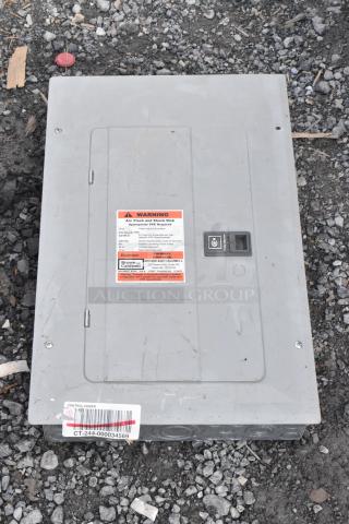 Gray metal electrical box with warning label about arc flash risk. Labeled "Brown and Caldwell." Barcode "CT-244-000034569."