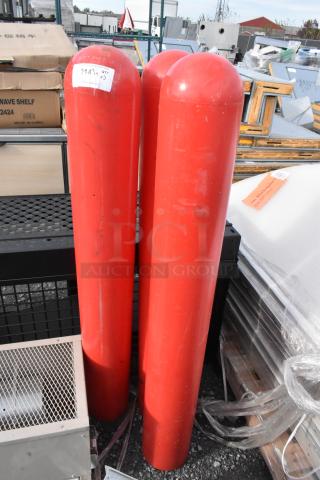 Three red column bumpers in good condition with visible sticker displaying quantity "3". Ideal for safety enhancement.