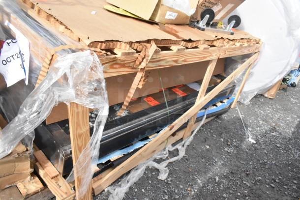 Brand new Giles GHM-8C hot food merchandiser in packaging; visible scratch and dent, 7-well, 208/240V, model marked on crate.