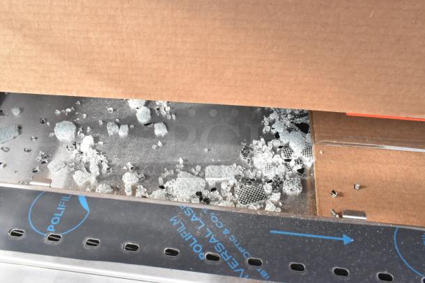 Brand new Giles GHM-8C hot food merchandiser with visible glass shards; labeled as scratch and dent; 208/240 volts.