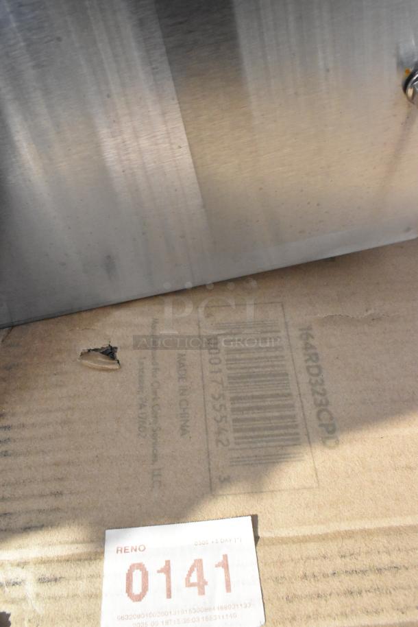 Cardboard packaging with slight tear and barcode visible, marked "164RD323CPD" suggesting inclusion in the item lot.