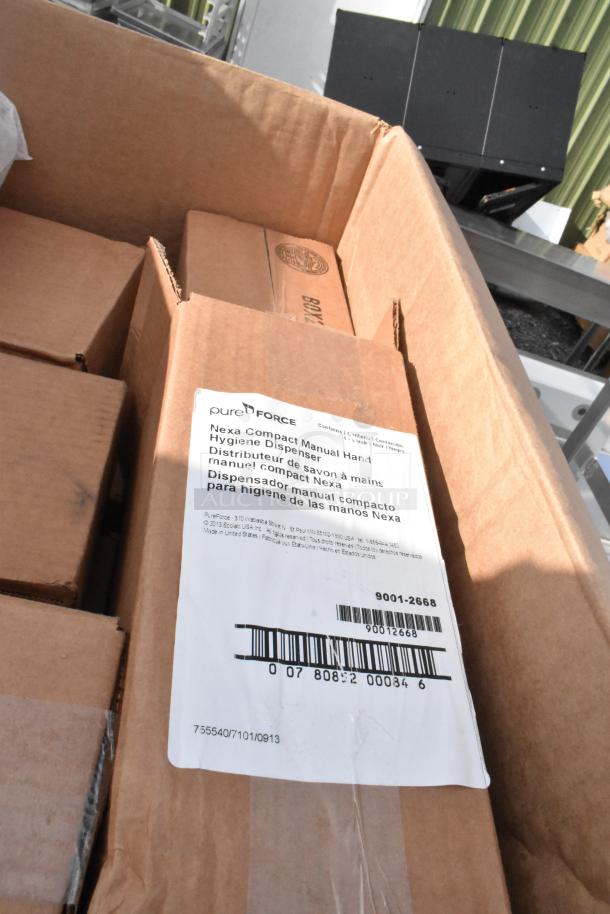 Box containing Nexa Compact Manual Hand Hygiene Dispenser with label showing product details and barcodes. Brand new.