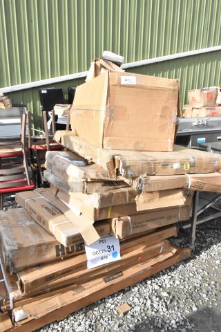 Stack of 12 new, scratch and dent items, including shelving unit, equipment stand, dunnage rack, and pan rack in original packaging.
