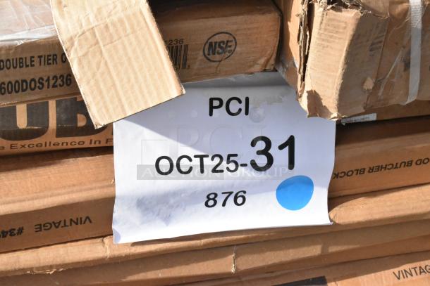 Cardboard boxes labeled NSF, stacked with a sign reading "PCI OCT25-31, 876." Contains shelving unit and racks. New, scratch and dent condition.